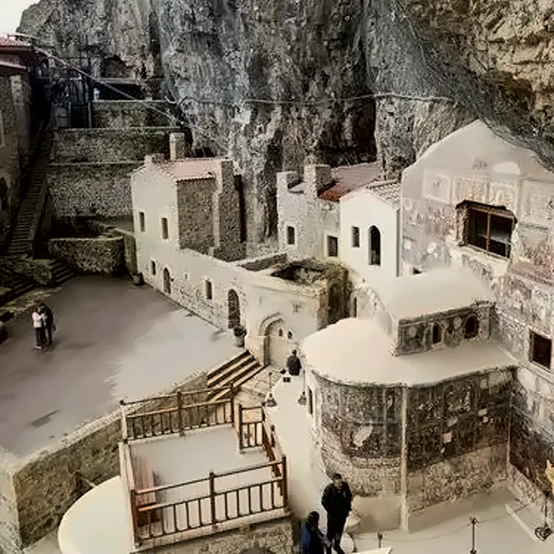 Courtyard of Sumela Monastery with frescoed chapel under the cliff